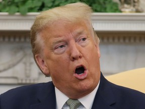 U.S. President Donald Trump is seen in the Oval Office of the White House in Washington, D.C., March 12, 2020.