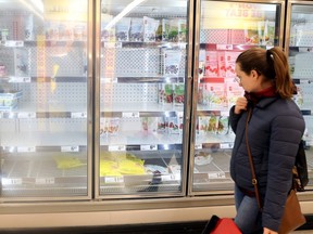 A woman finds empty shelves in Toronto on March 13, 2020. Dave Abel/Toronto Sun