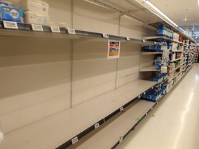 Shoppers fill the stores, and empty the shelves, stocking up on supplies on Friday in the wake of the Coronavirus outbreak.