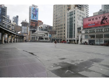 Dundas Square remains empty in Toronto on Friday March 20, 2020.