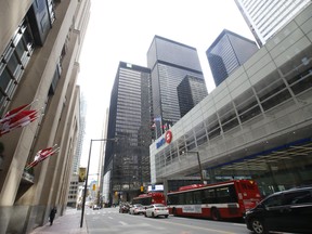 The downtown core of Toronto was sparse In the financial district at Bay and King Sts. on Tuesday.