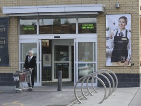 A patrons exist an LCBO store at Coxwell Ave. and O'Connor Dr. on Tuesday March 17, 2020 after it was announced LCBO stores would be cutting hours. Jack Boland/Toronto Sun