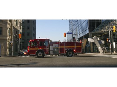 A Toronto Fire pumper truck from station 315 zooms westward across Bloor and Church Sts. around 5 p.m. to a call on Friday March 27, 2020. Jack Boland/Toronto Sun/Postmedia Network