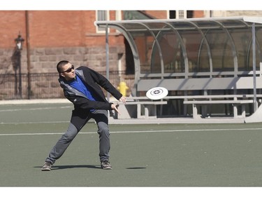 Firing off a Frisbee at the Back Fields sports complex at the University of Toronto downtown campus on Friday March 27, 2020. Jack Boland/Toronto Sun/Postmedia Network