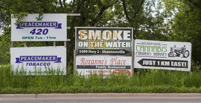 Signs promoting cannabis dispensaries along Highway 2 in Tyendinaga in Mohawk Territory, outside of Belleville, Ont. on Wednesday, June 26, 2019. (Ernest Doroszuk/Toronto Sun/Postmedia)