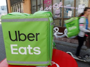 An Uber Eats food delivery courier rides a scooter in central Kiev, Ukraine on Sept. 9, 2019. (REUTERS/Valentyn Ogirenko)