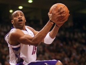 Toronto Raprtors' Vince Carter scores on 360° after a steal from Sacramento Kings' Vlade Divac (background), during the 2001 season. Toronto Sun/files