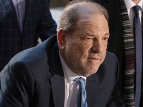 In this Feb. 24, 2020, photo, Harvey Weinstein arrives at New York Criminal Court for another day of jury deliberations in his sexual assault trial in the Manhattan borough of New York City.