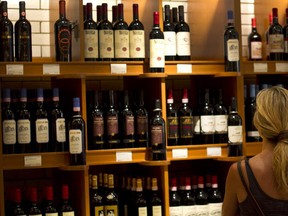 A customer browses wine displayed for sale at an LCBO in Toronto. (Sun files)