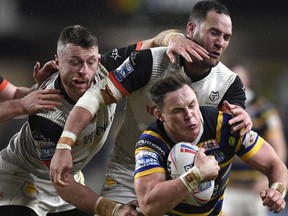 Leeds Rhinos’ Richie Myler is tackled by the Toronto Wolfpack defence during the Betfred Super League match in Leeds, England yesterday. Toronto lost 66-12. (Getty images)