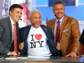 ESPN is reportedly considering College GameDay analysts Chris Fowler (left) and Kirk Herbstreit (right) as new Monday Night Football announcers. (GETTY IMAGES)