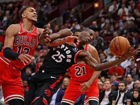 Raptors' Chris Boucher (right) and Daniel Gafford of the Chicago Bulls battle for the ball earlier this season. (GETTY IMAGES)