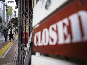 TOKYO, JAPAN - APRIL 08: Women walk near a closed sign outside a restaurant on April 08, 2020 in Tokyo, Japan. Japan's Prime Minister Shinzo Abe yesterday declared a state of emergency that will cover 7 of Japans 47 prefectures, including Tokyo and Osaka, as the Covid-19 coronavirus outbreak continues to spread in the country. The move will allow affected prefectures to take measures including expropriating private land and buildings and requisitioning medical supplies and food from companies that refuse to sell them. Tokyo recorded 144 new infections on Wednesday bringing the total in the capital to 1,339 with 85 deaths nationwide.   (Photo by Tomohiro Ohsumi/Getty Images)
