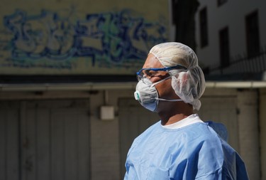 BERLIN, GERMANY - APRIL 08: Doctor's assistant Jose Perez waits at the garage that the medical practice he works for is using to receive and test possible Covid-19 patients during the coronavirus crisis on April 08, 2020 in Berlin, Germany. The practice is using the garage as a venue to take throat swab samples in order to avoid having possibly infected people come into the practice and contaminate it with the coronavirus. The city of Berlin has confirmed approximately 4,000 Covid-19 infections. Doctor Beate Krupka of the practice said the number of people testing positive from her samples has been declining recently. Germany has over 100,000 confirmed cases of infection and over 1,800 people have died.  (Photo by Sean Gallup/Getty Images)