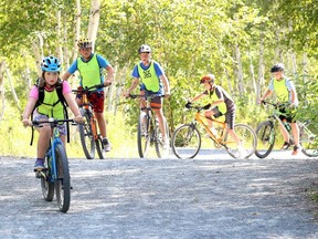 Veronica Warwick-Chong, 8, (front) leads a group of cyclists participating in the Sprockids mountain bike camp at Kivi Park, in Sudbury, Ont., on  Aug. 7, 2019. (Postmedia Network)