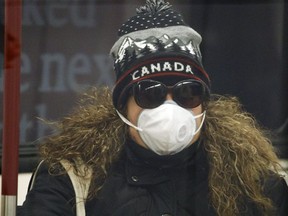 A woman is pictured wearing a mask on the subway on April 1, 2020. (Getty Images)