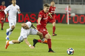 Toronto FC's Liam Fraser (right) battles with San Jose Earthquakes' Magnus Eriksson last season.