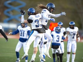 Montreal Carabins Reda Malki (left) and Marc-Antoine Dequoy celebrate a touchdown. Dequoy, a 25-year-old defensive back from the University of Montreal Carabins, turned down two other offers to become a Green Bay Packer on Saturday, sources say.