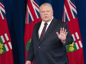 Ontario Premier Doug Ford departs at the end of the daily briefing at Queen's Park in Toronto on  April 28, 2020.