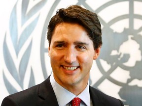 Justin Trudeau, Prime Minister of Canada pauses as he visits United Nations Secretary-General Ban Ki-moon at the UN in New York on March 16, 2016.