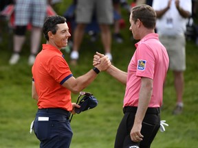 Rory McIlroy reacts with Webb Simpson after winning the 2019 RBC Canadian Open. The 2020 edition was officially cancelled this week.