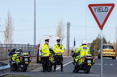 Garda - Irish Police - conduct a traffic checkpoint on the outskirts of Dublin, Ireland on April 8, 2020 as police excercised new powers to restrict people's movements in order to combat the novel coronavirus COVID-19. - Irish police set up nationwide traffic checkpoints on Wednesday, armed with new powers to enforce a lockdown designed to stem the spread of the coronavirus. (Photo by PAUL FAITH / AFP) (Photo by PAUL FAITH/AFP via Getty Images)