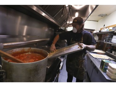 Michael Hunter (pictured) co-owner of Antler restaurant on Dundas St. W. prepared 70 meals - traditional and veggie for the Respirology staff at St. Michael's Hospital. The meals included veggie pasta, a Venison pasta, salad, a sticky toffee dessert and juice. Thursday April 9, 2020. Jack Boland/Toronto Sun/Postmedia Network