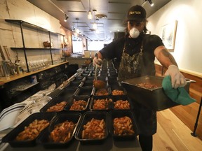 Michael Hunter (pictured), co-owner of Antler restaurant on Dundas St. W., prepared 70 meals for the Respirology staff at St. Michael's Hospital. The meals included veggie pasta, a venison pasta, salad, a sticky toffee dessert and juice. Thursday April 9, 2020. (Jack Boland/Toronto Sun/Postmedia Network)