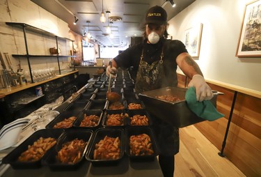 Michael Hunter (pictured), co-owner of Antler restaurant on Dundas St. W., prepared 70 meals for the Respirology staff at St. Michael's Hospital. The meals included veggie pasta, a venison pasta, salad, a sticky toffee dessert and juice. Thursday April 9, 2020. (Jack Boland/Toronto Sun/Postmedia Network)