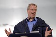 New York City Mayor Bill de Blasio speaks at an indoor training center at the USTA Billie Jean King United States Tennis Center, which will be partially converted into temporary hospital during the COVID-19 outbreak, in the Queens borough of New York City, New York, U.S., on March 31, 2020. (REUTERS/Stefan Jeremiah)