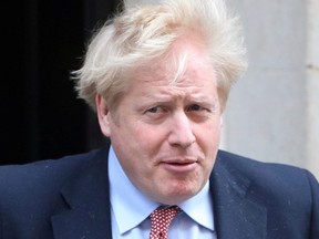 Britain's Prime Minister Boris Johnson "is in good spirits" while under observation in hospital after testing positive for COVID-19, his spokesperson said Monday, April 6, 2020.