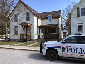 In this April 1, 2020, file, a Brockville Police car is seen outside a house where two bodies were discovered.
