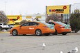 A pair of Beck Taxis sit idle on Thursday, April 16, 2020.