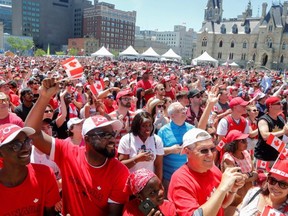 Canadians celebrate during Canada Day festivities on Parliament Hill in Ottawa, on July 1, 2019.
