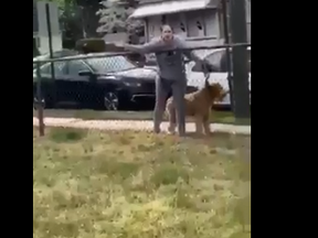 A screengrab from a video of a woman yelling at teens playing football in N.J.