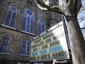 A sign promoting hand washing stands outside a closed church during the global outbreak of  COVID-19 in Toronto  on April 6, 2020.