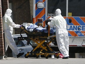 Patients are transported at the Orchard Villa Retirement Residence in Pickering on April 22, 2020.