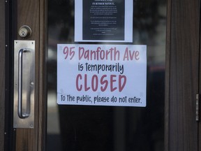 Signage on Danforth Avenue reflect the reality that many businesses may not survive the fallout of COVID-19.