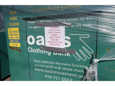 Donations bins around the city have been sealed up by the companies that run them like Oasis Clothing Bank located here at Queen St. East and Silver Birch Ave.  on Wednesday April 8, 2020. Jack Boland/Toronto Sun/Postmedia Network