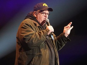 Director Michael Moore speaks during a rally by U.S. Democratic presidential candidate Senator Bernie Sanders in Cedar Rapids, Iowa, U.S., February 1, 2020.