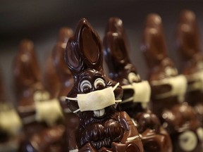 Chocolate Easter bunnies wearing protective masks are seen in the workshop of Belgian artisan chocolate maker Genevieve Trepant, during the COVID-19 outbreak in Lonzee, Belgium on April 10, 2020.