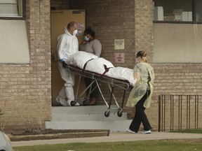 A body is removed from the Eatonville Care Centre long-term facility on The East Mall in Toronto on Tuesday, April 14, 2020.