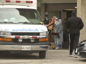A resident is removed from the Eatonville Care Centre in Etobicoke via ambulance to hospital on Friday April 17, 2020.
