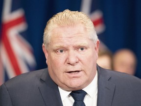 Ontario Premier Doug Ford answers questions during the daily briefing on the COVID-19 pandemic at Queen's Park in Toronto.