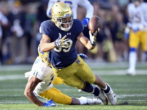 Wideout Chase Claypool of the Notre Dame Fighting Irish, trying  to make a catch, could be the first Canadian taken in the NFL Draft sometime in the next three days..  (Photo by Quinn Harris/Getty Images)