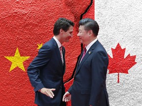 China and Canada flags on cracked concrete (International conflict concept)