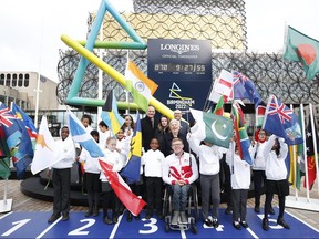 Athletics athlete Sarah McDonald of Team England, David Grevemberg, Chief Executive of the Commonwealth Games Federation, Matthieu Baumgartner, Vice President Marketing Longines, Dame Louise Martin, President of the Commonwealth Games Federation and Athletics para-athlete Nathan Maguire of Team England pose for a photo during the launch of the Birmingham 2022 Commonwealth Games official Countdown Clock on March 9, 2020 in Birmingham, England. (Miles Willis/Getty Images for Birmingham 2022)