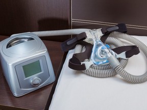 Home CPAP therapy machine in a bedroom