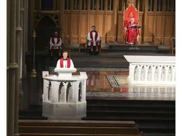 Roman Catholic Cardinal Thomas Colllins presides over Good Friday mass at St, Michael's Cathedral Basilica on Bond St. To and empty church on Good Friday on Friday April 10, 2020. Jack Boland/Toronto Sun/Postmedia Network