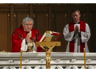 Roman Catholic Cardinal Thomas Colllins presides over Good Friday mass at St, Michael's Cathedral Basilica on Bond St. To and empty church on Good Friday on Friday April 10, 2020. Jack Boland/Toronto Sun/Postmedia Network